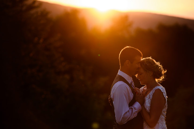 Lincoln vermont wedding;Vermont wedding photographers;sun flare wedding photo;sunset wedding photo