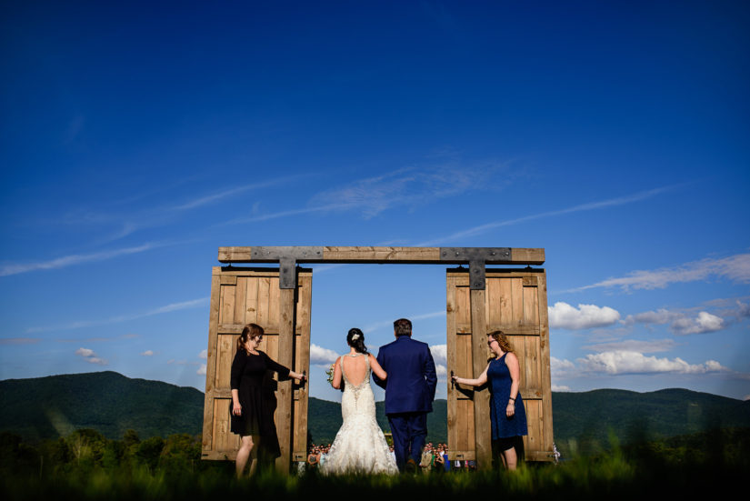 Barn Doors;Chittenden;Mountain Views;The bride and her father walk down the isle at the Mountain Top Inn;Vermont Wedding;Wedding Ceremony