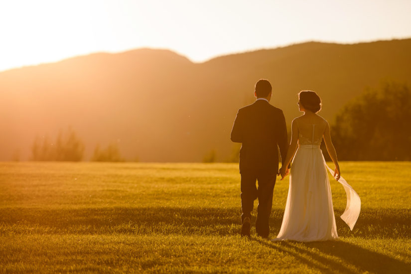Stowe wedding;Trapp Family Lodge Wedding;Vermont wedding photographers;sun flare;sunset wedding photo