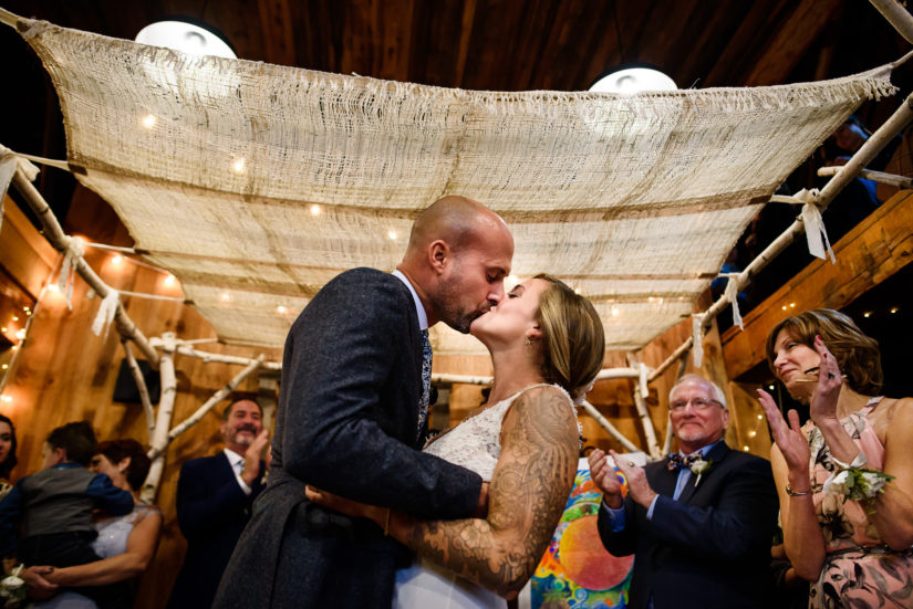 Jewish ceremony;Tunbridge vermont wedding;Vermont wedding photographers;backyard wedding;first kiss